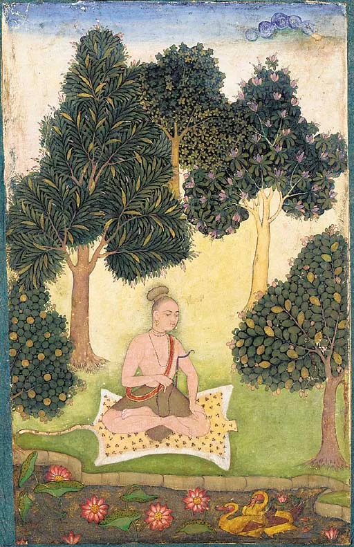 Person practicing meditation in a garden setting for mental wellness